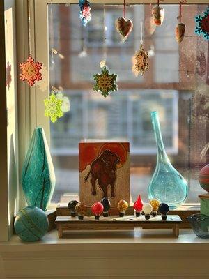 Blown glass, acrylic snowflakes, and an illustrative painting of a bison