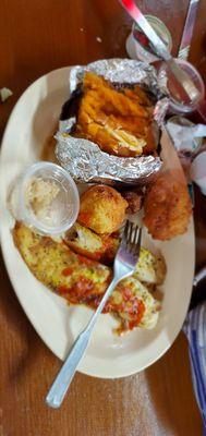 Baked sweet potato, grilled lemon pepper catfish and hush puppies