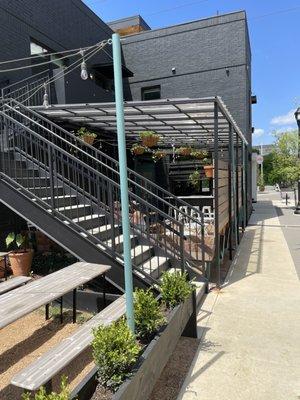 Sidewalk view of the outdoor patio seating that they share with the wine bar.