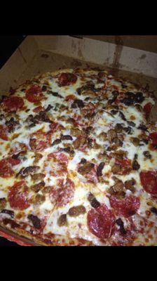 Thin crust with beef, sausage, pepperoni and extra cheese...cut into squares...YUMMY!!