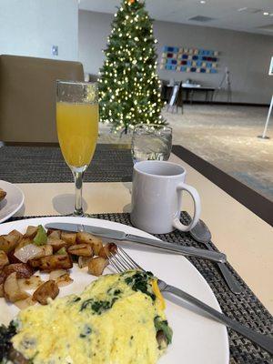 Delicious mushroom and spinach omelet with a mimosa!