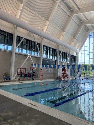 Lap pool has pool basketball and a climbing wall