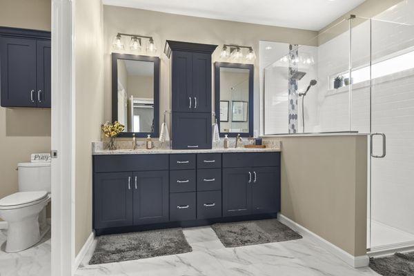 Transitional master bath remodel in Springfield, IL. Lots of storage, large walk in shower, beautiful quartz countertops with double sinks.