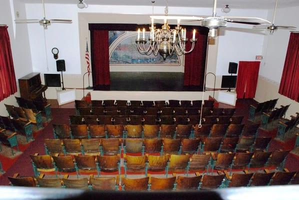 Facing the stage from the balcony