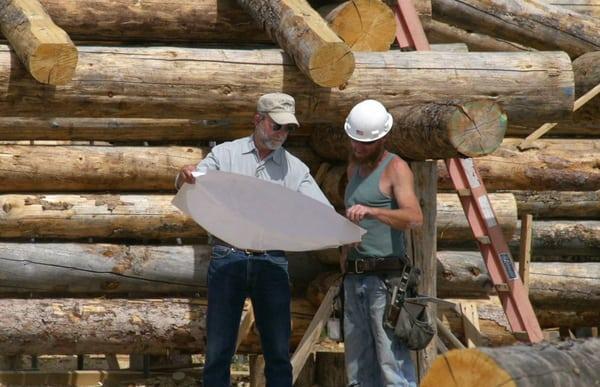 Owner, Jay Pohley, overseeing the a custom log home project.