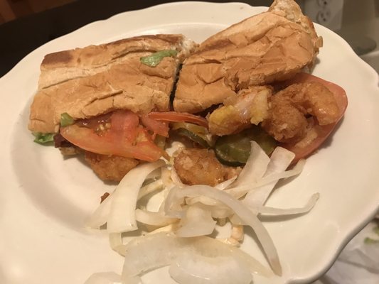 One half of the sorry excuse of a Shrimp Po Boy with a gang of onions picked out that were supposed to not be on the sub.