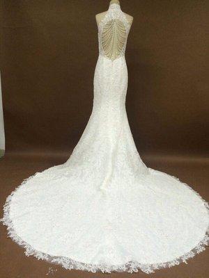 Custom open back wedding gown with pearl and crystal details