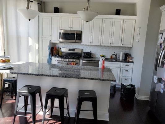 Beautiful kitchen, white cabinets are toughest to clean. Once you start cleaning that's when you see how dirty they are.