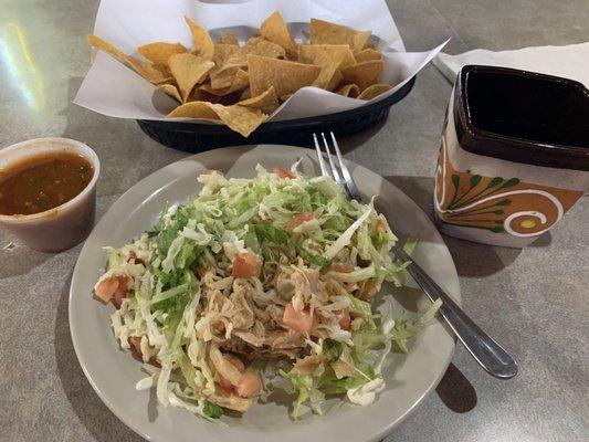 Chicken tostada chips and salsa and special coffee made with cinnamon