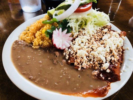 Chicken enchiladas plate.