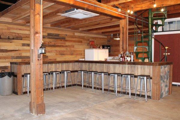 Bar area wraps around spiral staircase.