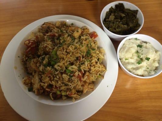 Jambalaya with sides of mixed greens and cauliflower/mashed potatoes.