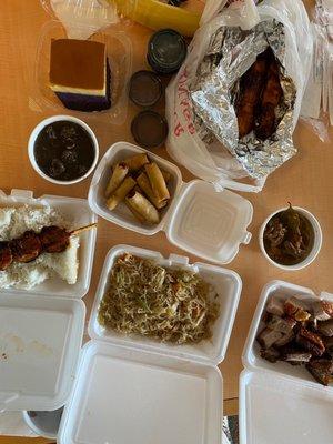 Lunch combos with adobo and diniguan, lumpia, bbq skewers, lechon