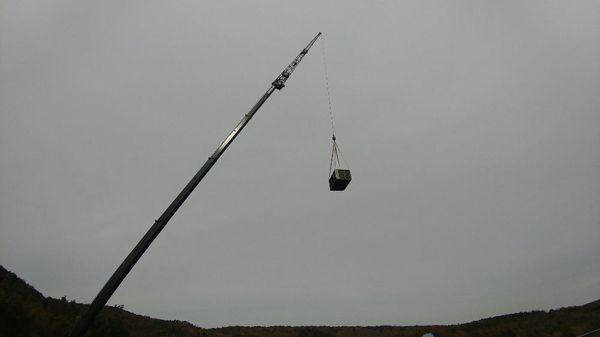 Using a crane to set a self contained package unit on a rooftop!