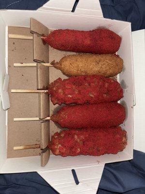 The corn dogs are half and half so it has cheese and beef sausages in them and the cheese is so rich and stretchy delicious