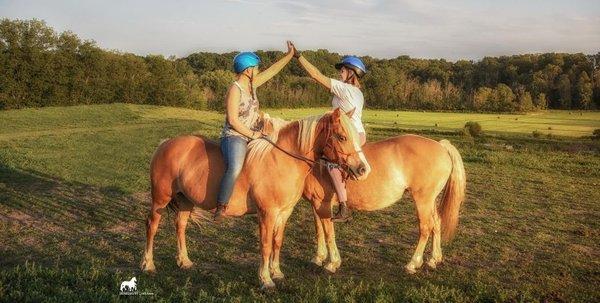 Friends riding bareback