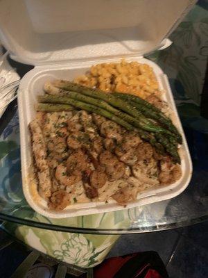 Chicken and shrimp Alfredo, macaroni and cheese with asparagus. Plate can be eaten for two days.