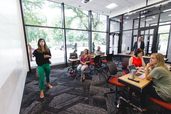 Hold your next meeting or presentation in The Garage - equipped with a projector, whiteboard wall, and glass garage door for sound isolation