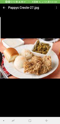 CHICKEN FRIED STEAK SERVED WITH MASHED POTATOES AND GRAVY ALONG WITH GREEN BEANS AND SWEET BUTTERY CORN AND A ROLL