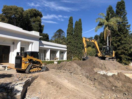 Excavation of a 120' x 60' swimming pool originally constructed in 1918.