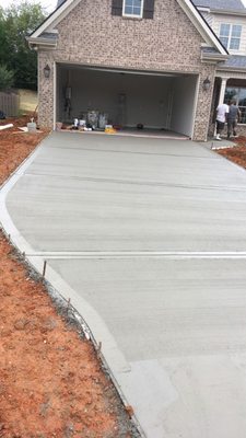 Broom driveway "picture framed"
 Picture framed is a way of saying slick edges and slick expansion joints