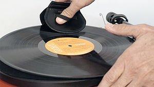 placing vinyl on turntable