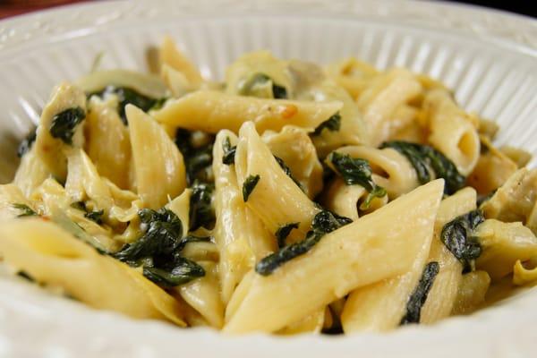 spinach, onion, garlic & artichoke hearts in a light cheese sauce and tossed with penne