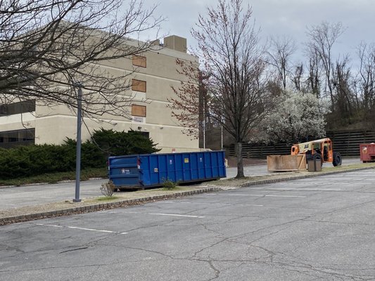 Boarded windows and cargo containers.