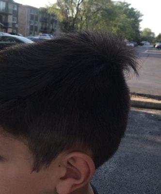 Terrible haircut, look at the crown of his head??? Who does this???