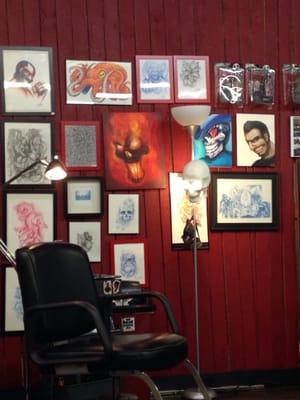 Pictures on wall and tattoo seating area