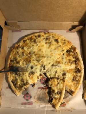 Large steak and cheese pizza with extra cheese.