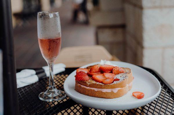 Stuffed french toast with strawberries and a cranberry mimosa to chase it all down