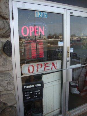 Hours of operation, front entry door.