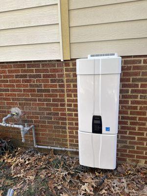 An outdoor tankless water heater complete