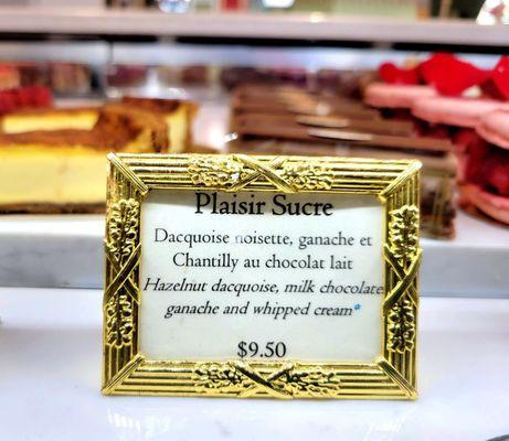 The display case sign for Plaisir Sucre.