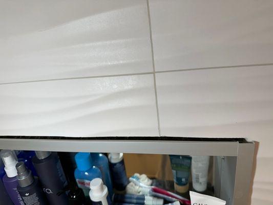 open gap above mirror