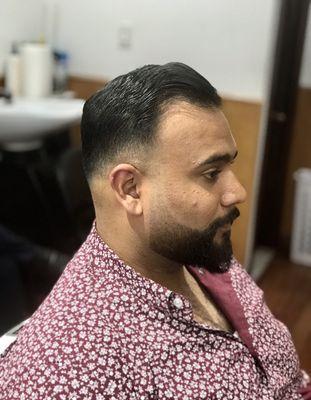 Low skin fade and a faded beard