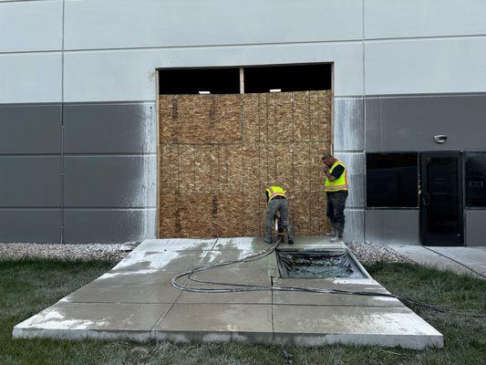 14'x14' Dock door Cut through with Ring saw and Push Over to be cut on ground