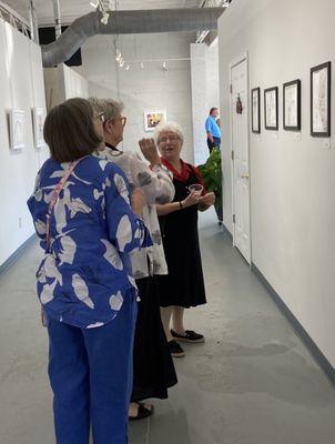 Visitors enjoying art