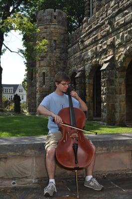 A student of the Sewanee Summer Music Festival rehearsing outside