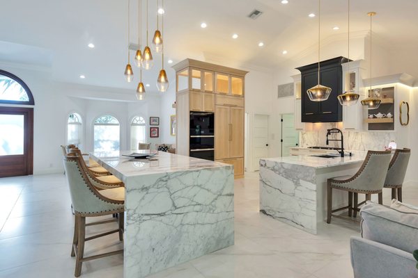 Country Club Drive, Atlantis, FL, kitchen remodel featuring waterfall Carrara marble countertops.