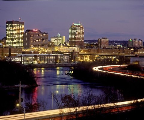 Photo of downtown and the mills at night.