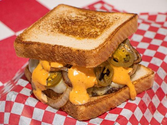 "Spicy Patty Melt"
Fresh ground brisket patty served with Pepper jack Cheese, Grilled onion and Jalapeño with spicy mayo on Texas Toast.