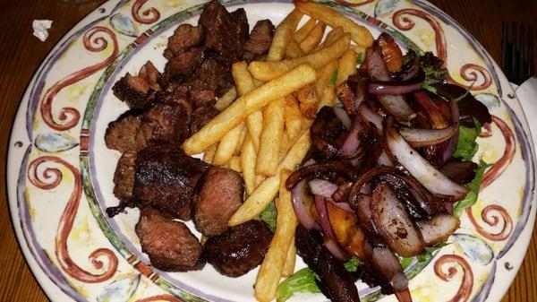 Steak Frites with caramelized red onions, Portabella mushrooms, French Fries and salad