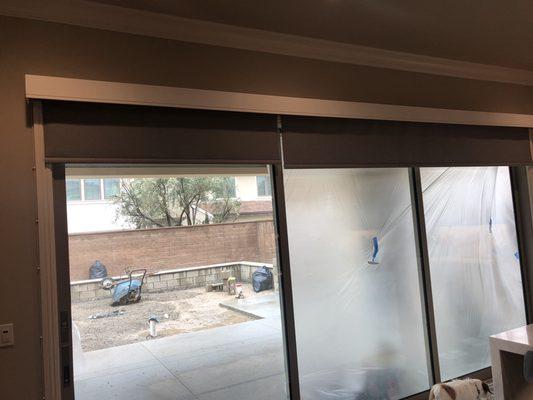 Giant motorized roller shade and cornice box for kitchen window/sliding door area.