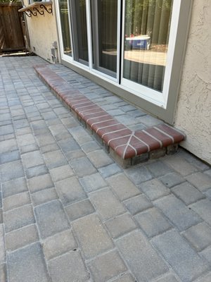 Calstone classic cobble tan , red , charcoal color in a linear pattern