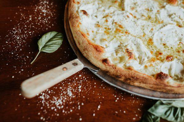 3 Cheese Bianca Pizza. Mozzarella, ricotta, asiago and olive oil base.