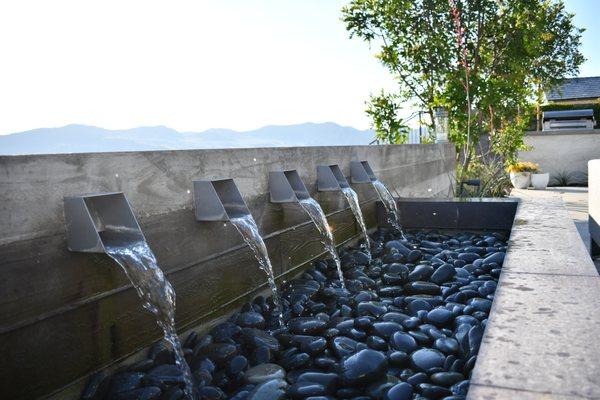 Custom water features such as this are a perfect way to personalize and revamp your outdoor space.