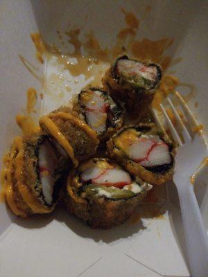 Moments after diving into my Firecracker roll: jalapeno, cream cheese, crab stick, rolled and tempura!