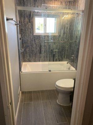 Tiles on floors & bath room & glass door installation.